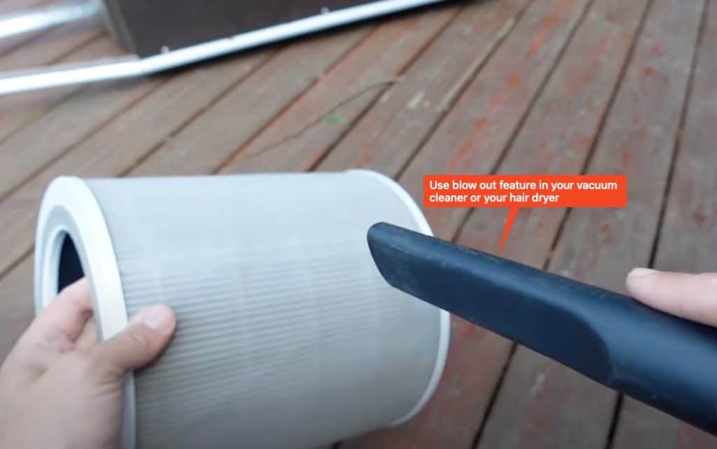 How to Clean Your Air Purifier: blow filter and pre-filter for deep clean